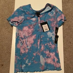 The brand is art class its large but, runs small. Is blue and pink tie dyed.